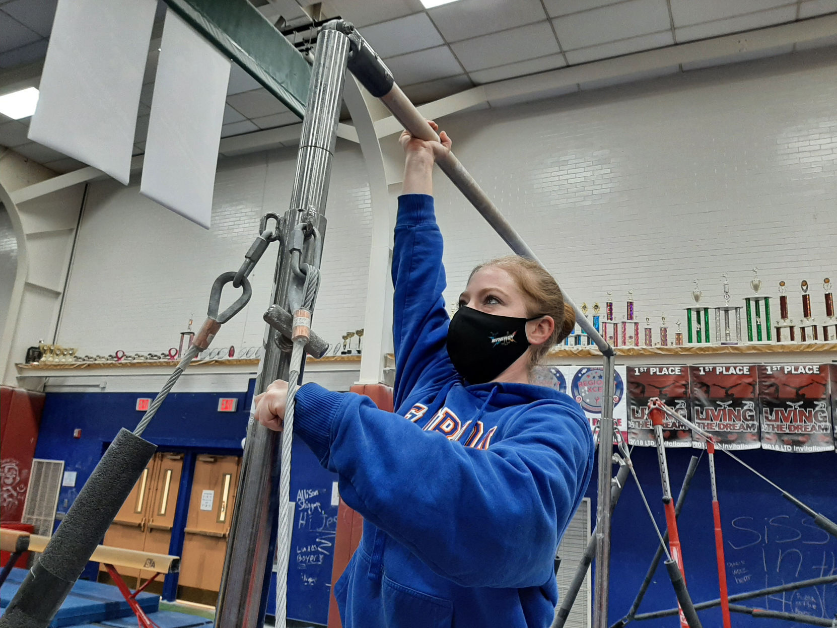 Energy Gymnastics coordinator prepares apparatus